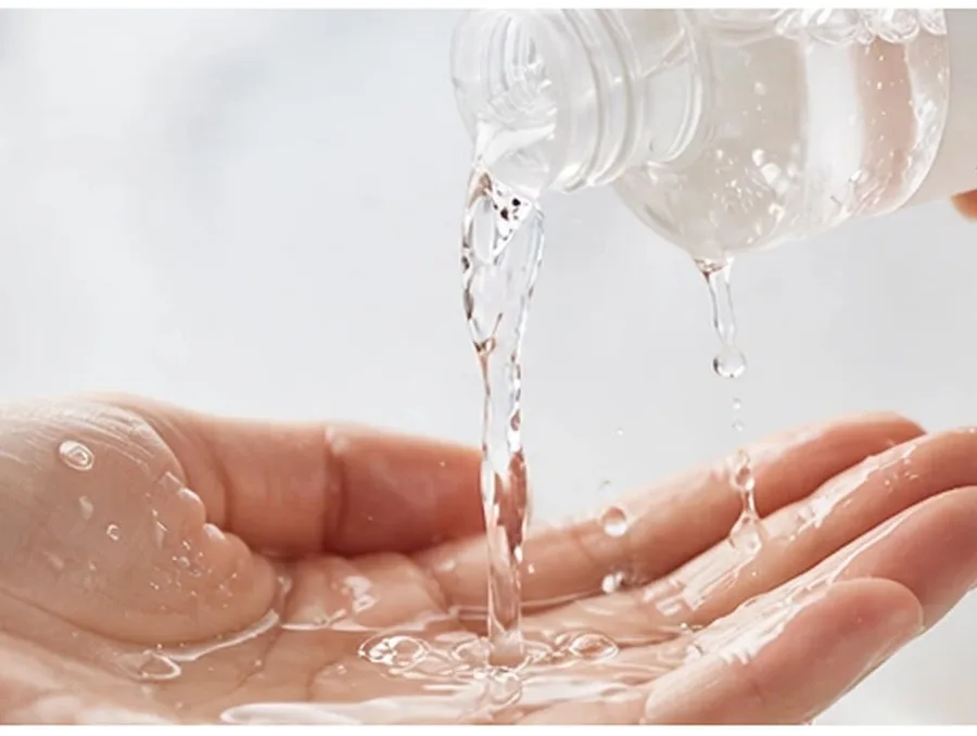Clear heartleaf toner poured into cupped hands
